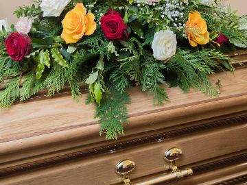 A wreath of flowers on a coffin
