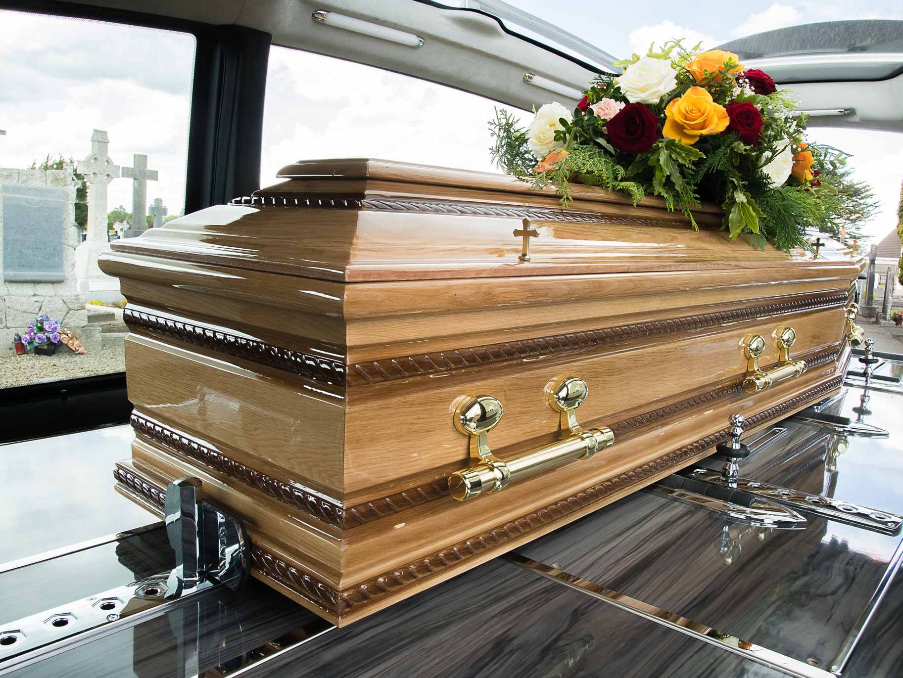 Coffin in a Ramon Massey hearse